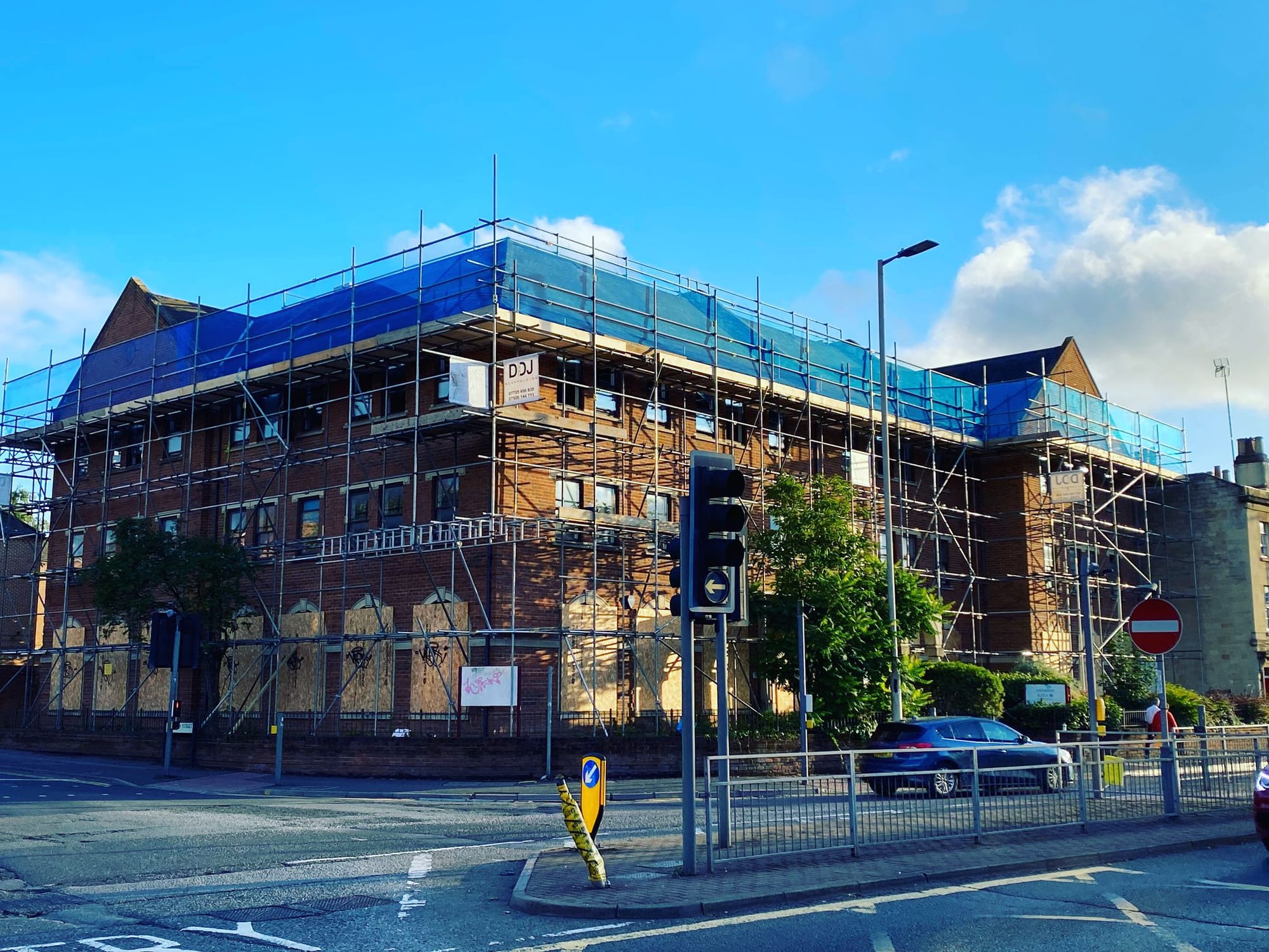 Scaffolding erected across the front of a Victorian corner block
